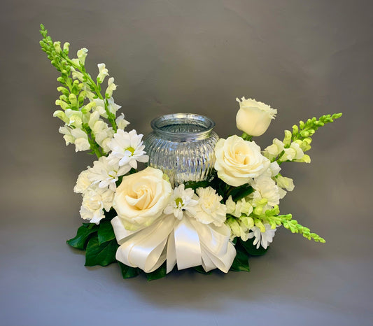 With room for a photo or urn, this celebration of life arrangement features fresh white flowers. Other colours are available, same day delivery to funeral home, house or ceremony. Delivery to North York Scarborough Greater Toronto Area.