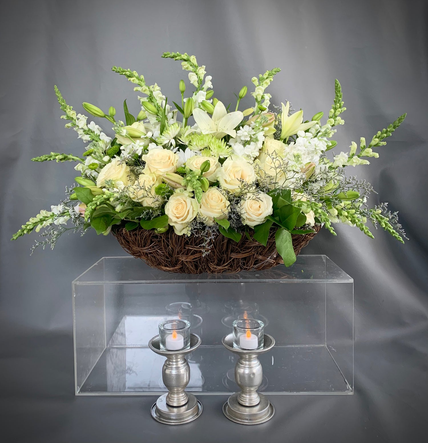 Make a statement with this significant sized basket full of delicate white and green fresh cut flowers delivery to North York Scarborough Markham and Toronto