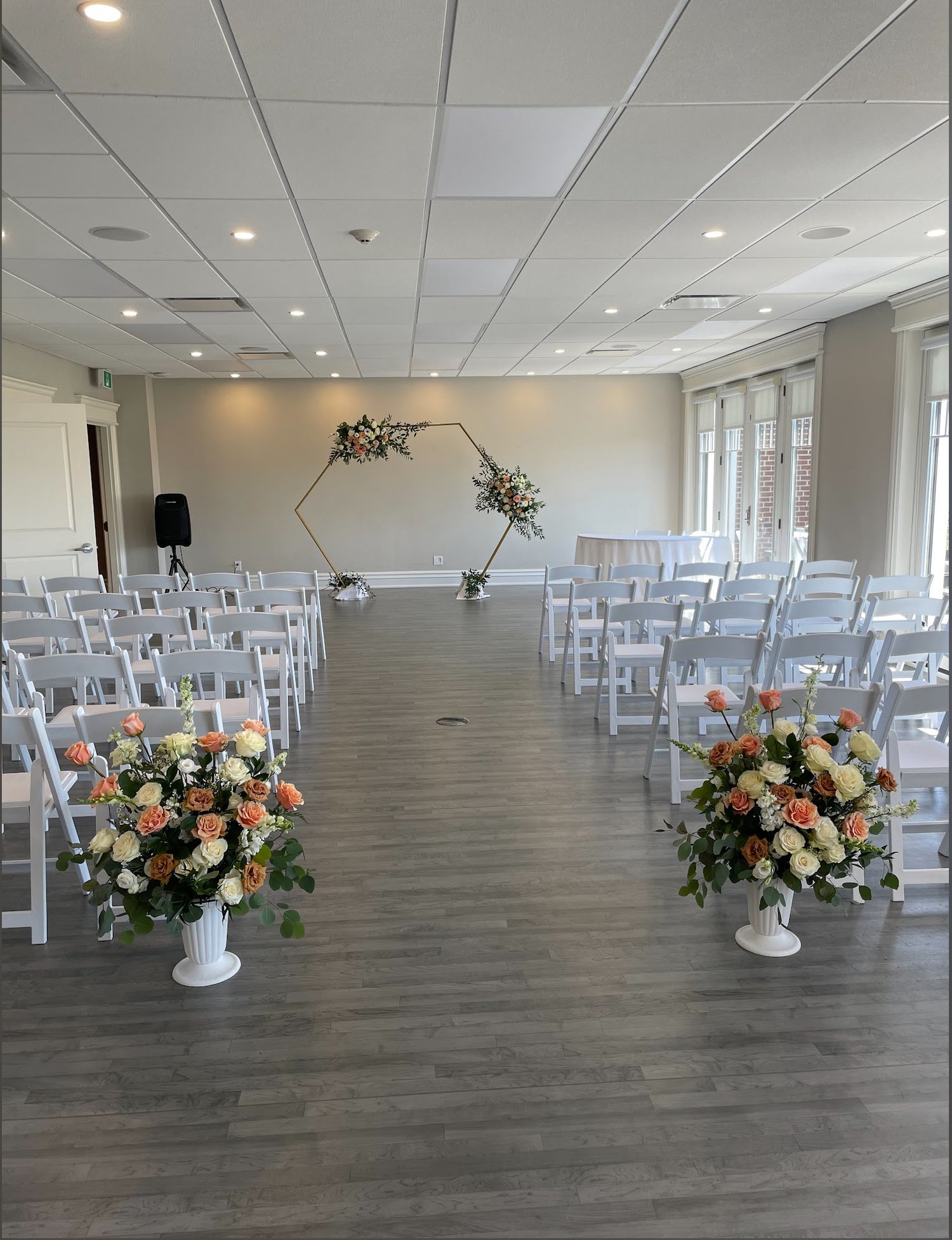 Peach and white arch and aisle arrangements for weddings and events delivery to North York Scarborough Markham and Toronto