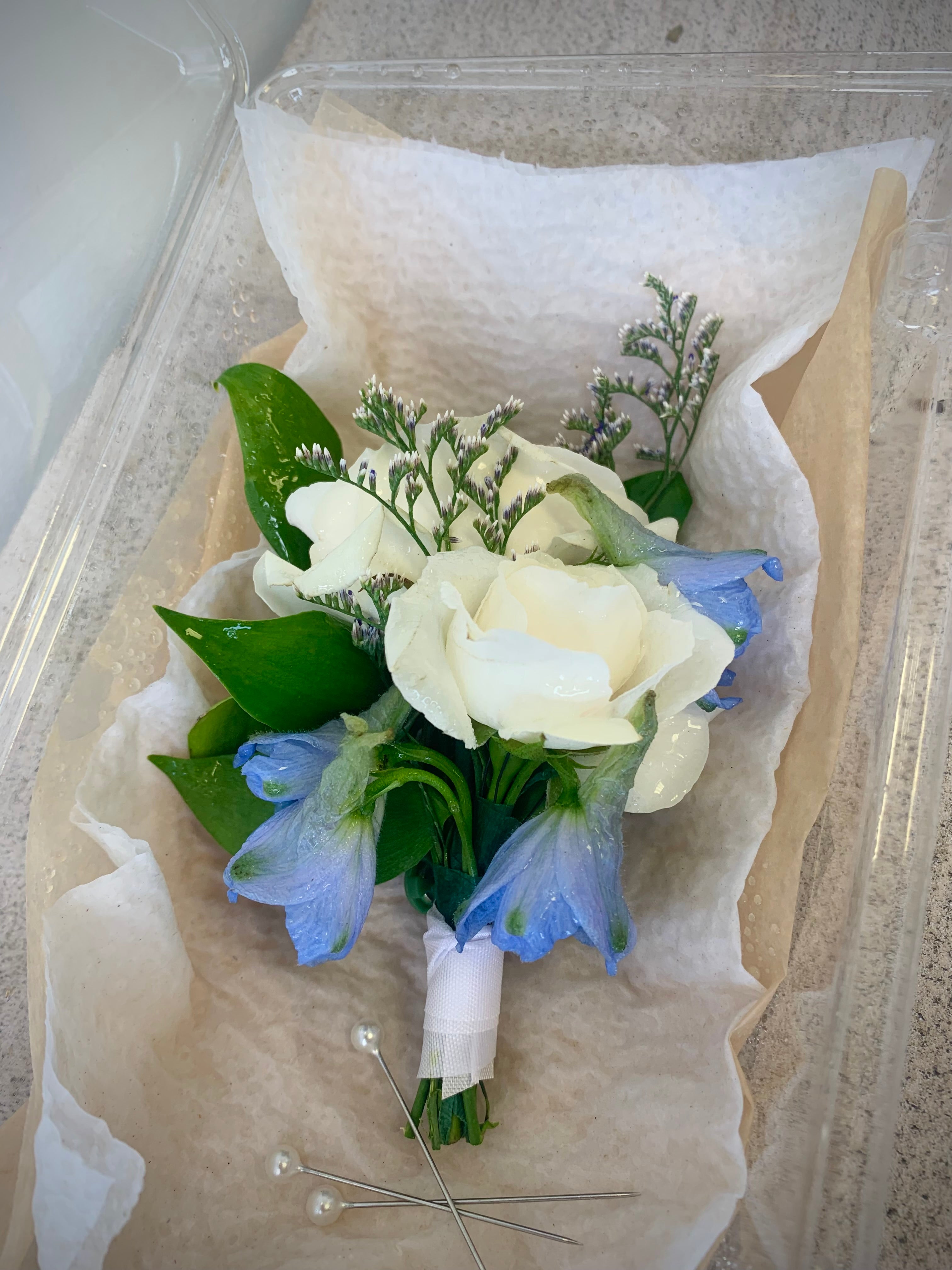 White and blue boutonniere with Tweedia and roses for outdoor wedding at The Vue in Etobicoke